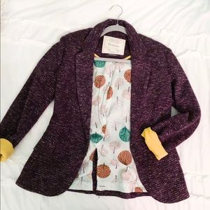 Purple blazer with yellow upturned sleeves